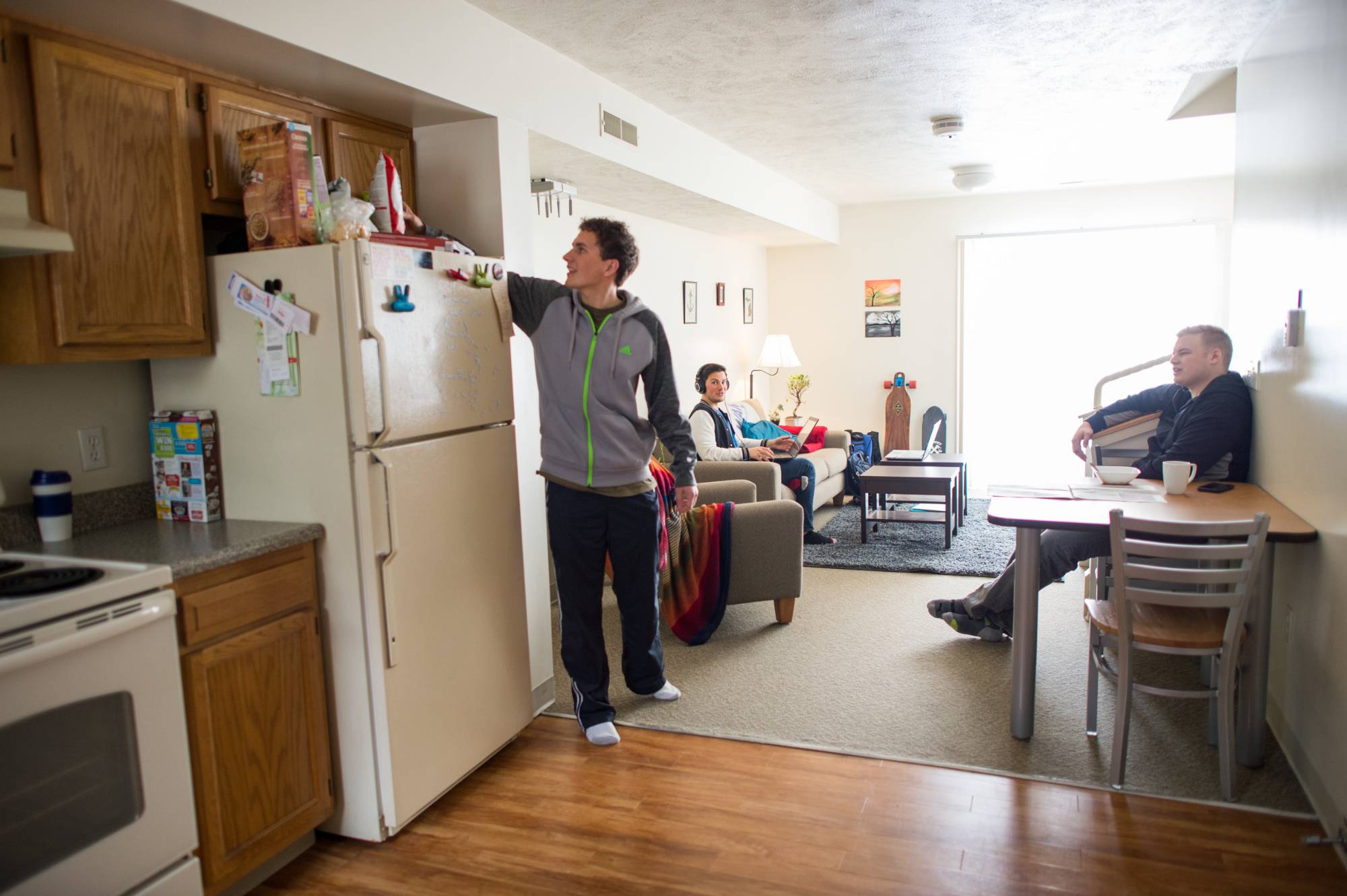 Image of students in a laker village apartment